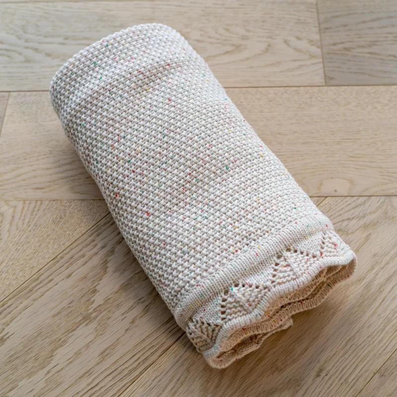 mabel fox knitted baby blanket oatmeal confetti scaled